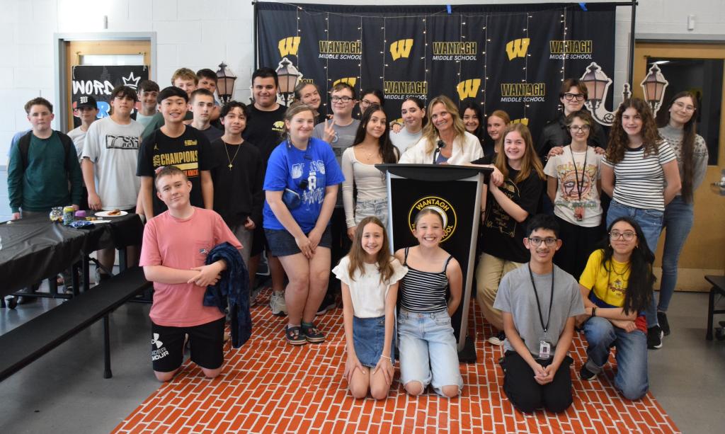 group of kids sitting on the floor